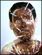 Поздравители решили поздравить именинника, подарив ему шоколадную маску, и ткнули его лицом в торт.